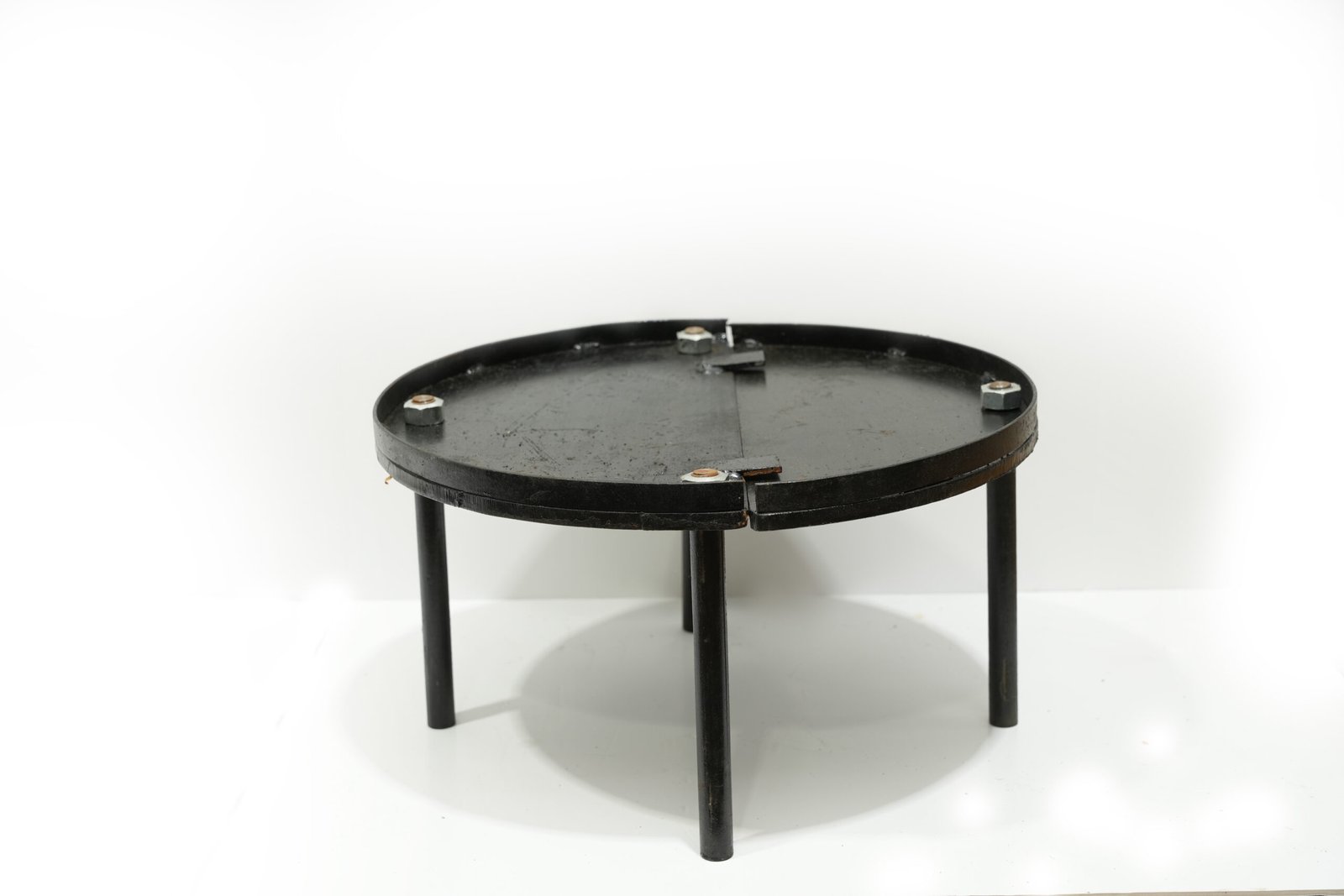 In the image is a Tandoor Metal Plate which is an accessory of tandoor