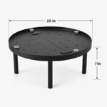 Tandoor Baffle Plate AS02 – assembled baffle plate with dimension annotations showing 20 inches diameter width and 7 inches height from ground to plate surface, with four steel legs, perforated surface, centre divider bar, and hex bolt leg fasteners on light gray background