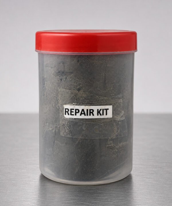 Tandoor Clay Pot Repair Kit AS08 – front view of clear cylindrical plastic container with red lid containing dark grey repair clay compound, showing REPAIR KIT label with label edges peeling, placed on a brushed stainless steel surface in a minimal studio setting