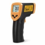 Tandoor Digital Thermometer Gun AS16 – low angled view of the orange and black infrared thermometer gun on white background, showing the backlit LCD display reading 78.8 Degree F, SCAN HOLD and MAX indicators, MODE button and control buttons, with the yellow caution laser warning label and distance-to-spot ratio diagram visible on the side panel