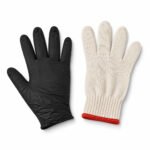 Tandoor Heat Resistant Gloves AS15 – wide flat-lay product shot on white background showing both glove components: the black nitrile outer glove on the left with full palm and finger detail, and the cream cotton knit heat-resistant inner liner with red trim cuff on the right, showing the complete two-layer glove set included with the product