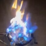 Tandoor Oven Burner AS06 – nozzle-tip tandoor burner ignited inside a tandoor oven showing intense blue and orange gas flames rising from the stainless steel nozzle tips, captured at initial ignition with high flame output