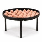 Tandoor Oven Clay Balls AS07 – square format front view of terracotta clay balls loaded onto a round black steel tandoor baffle plate standing on four legs, showing the clay balls packed across the plate surface, on white background