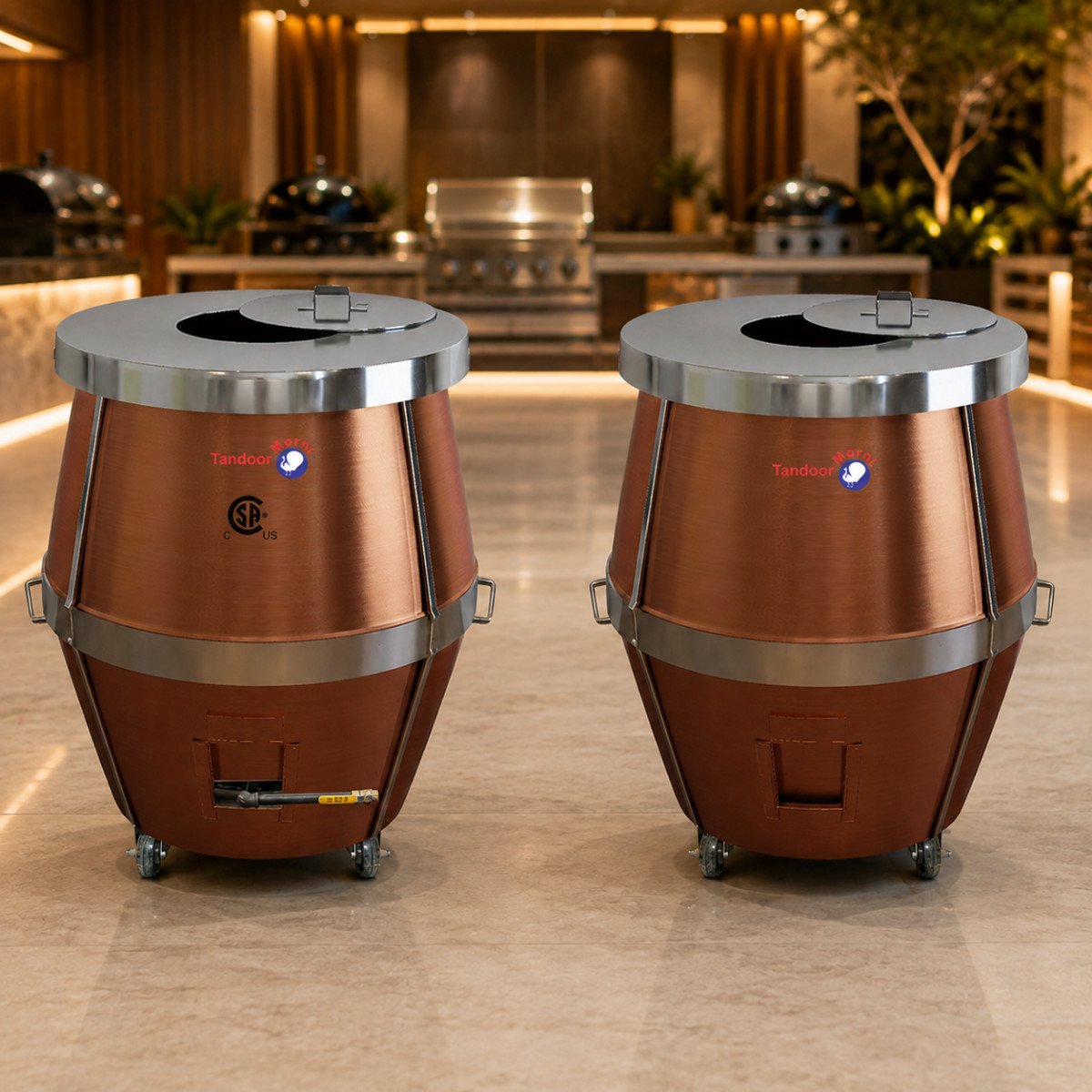 Pair of copper tandoor ovens on display at a Tandoor Morni showroom — Propane Gas Tandoor Oven A02 and Charcoal Tandoor Oven CU02 — hand-finished copper tandoors with CSA certification